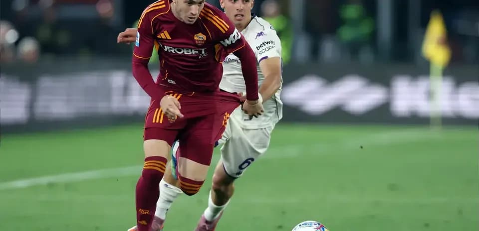Player from AS Roma dribbling past opponent in match Player from AS Roma dribbling past opponent in match