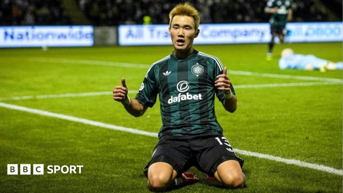 Player celebrating on the pitch after scoring Player celebrating on the pitch after scoring