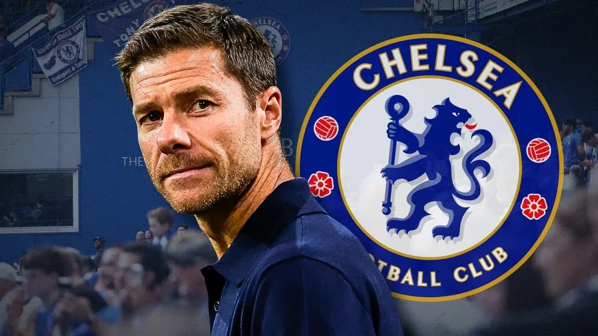 Coach in front of Chelsea FC logo at stadium Coach in front of Chelsea FC logo at stadium