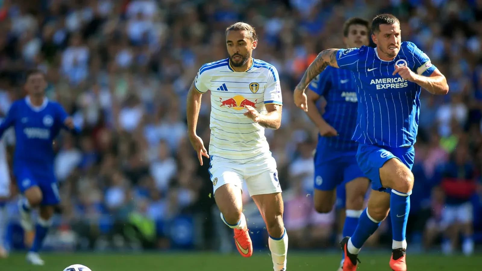 Leeds player running with the ball during match Leeds player running with the ball during match