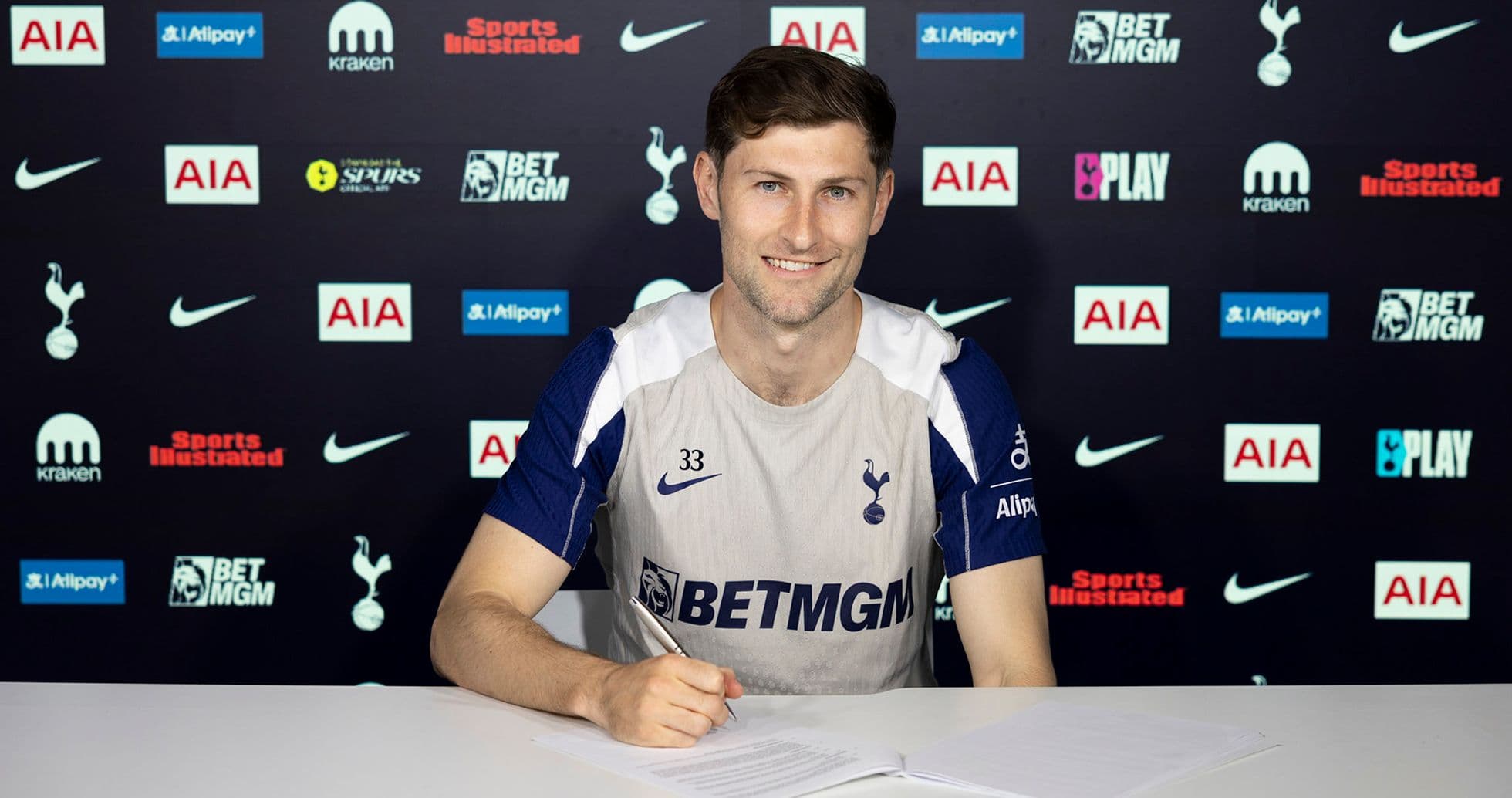 Player signing contract at Tottenham Hotspur press conference Player signing contract at Tottenham Hotspur press conference