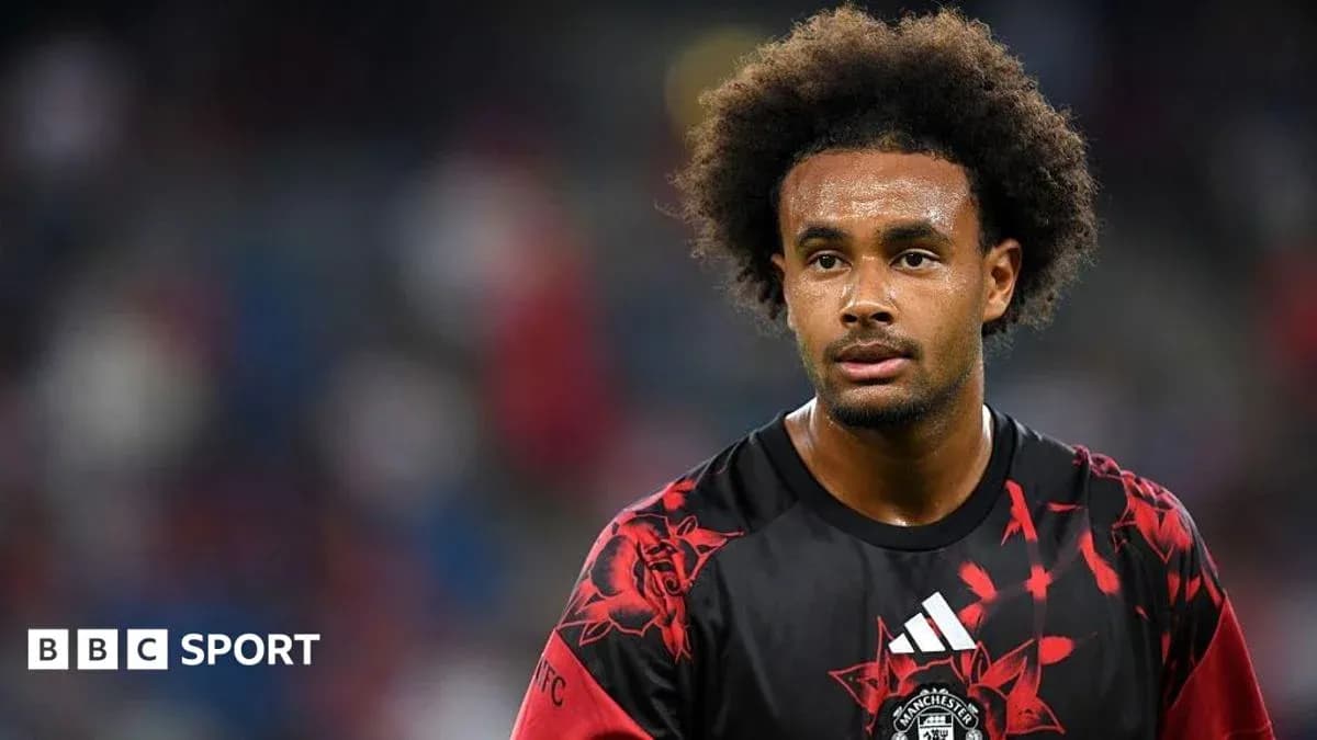 Player wearing Manchester United jersey on field Player wearing Manchester United jersey on field