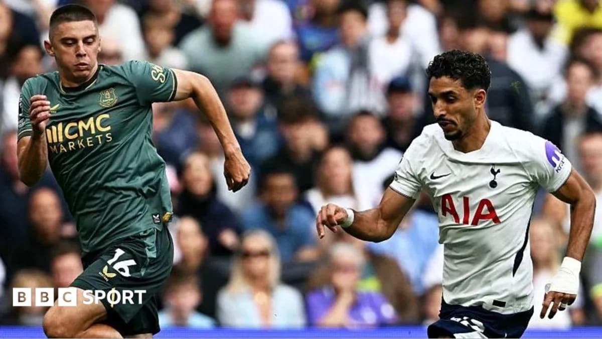 Two players sprinting during a football match Two players sprinting during a football match