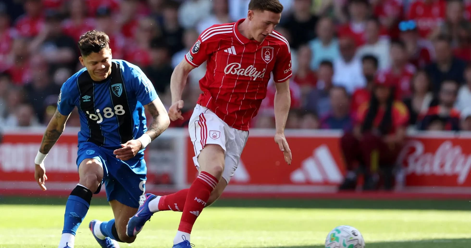 Nottingham Forest player dribbling against Bournemouth Nottingham Forest player dribbling against Bournemouth