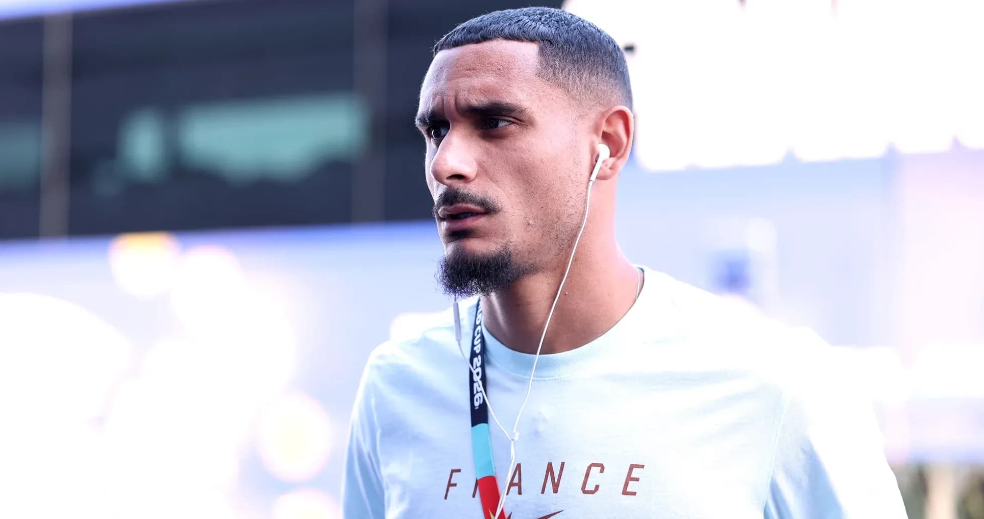 Player wearing headphones, arriving at venue Player wearing headphones, arriving at venue
