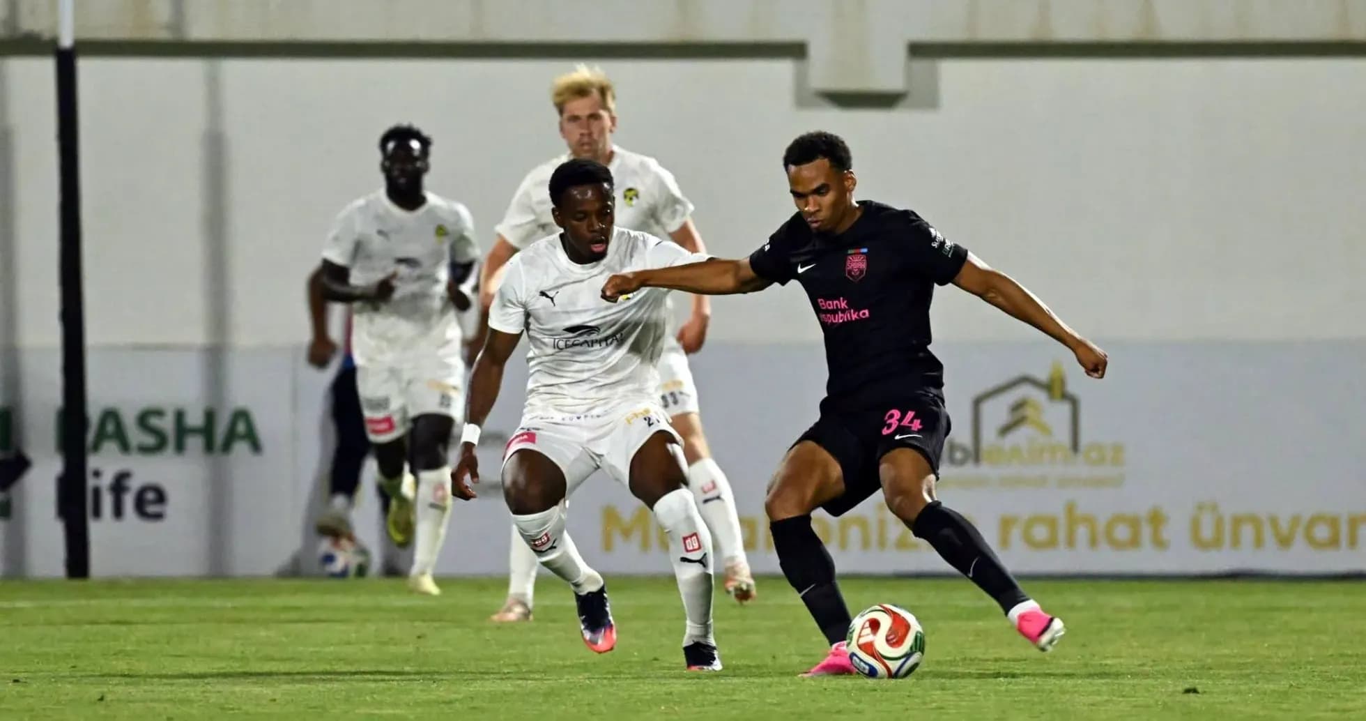 Player dribbling during KuPS vs Sabah FA match Player dribbling during KuPS vs Sabah FA match