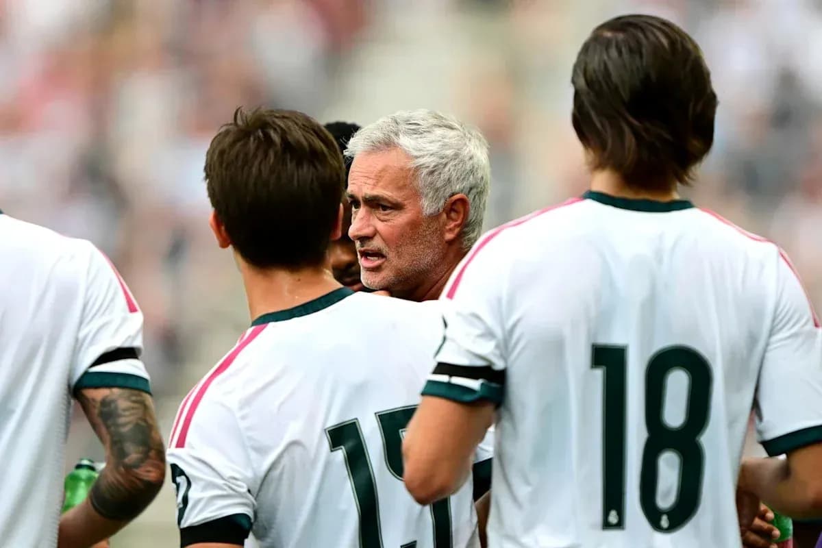 Manager discussing strategy with players during match Manager discussing strategy with players during match