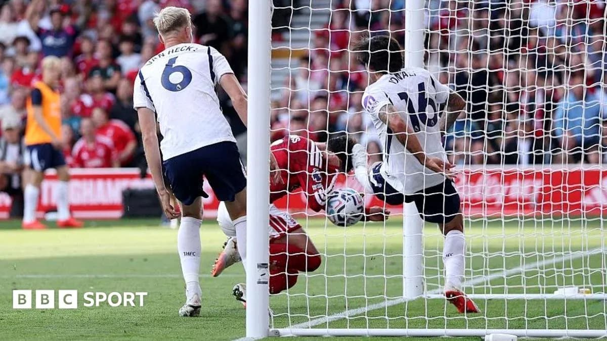 Player attempting to score while goalkeeper intervenes Player attempting to score while goalkeeper intervenes
