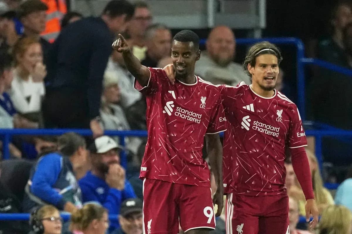 Two Liverpool players celebrating during a match Two Liverpool players celebrating during a match
