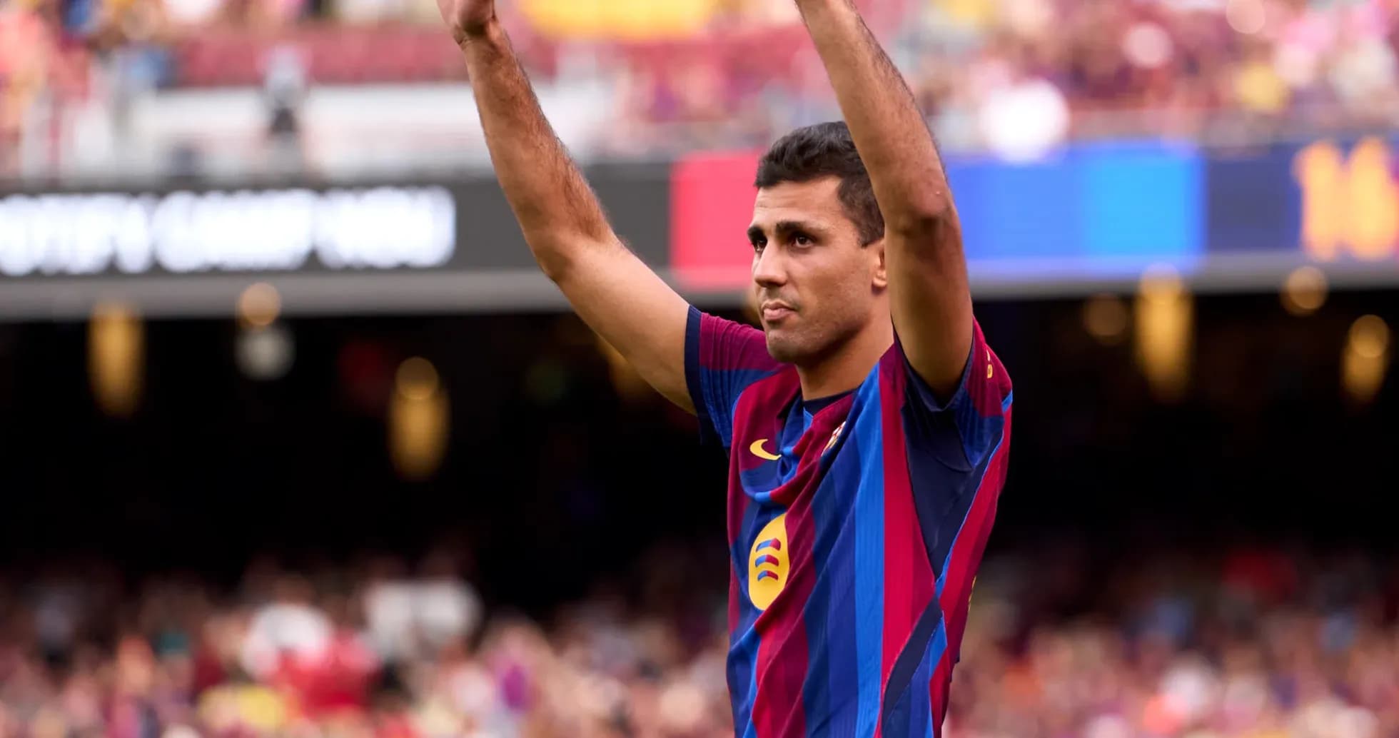 Player celebrating with raised arms at Camp Nou Player celebrating with raised arms at Camp Nou