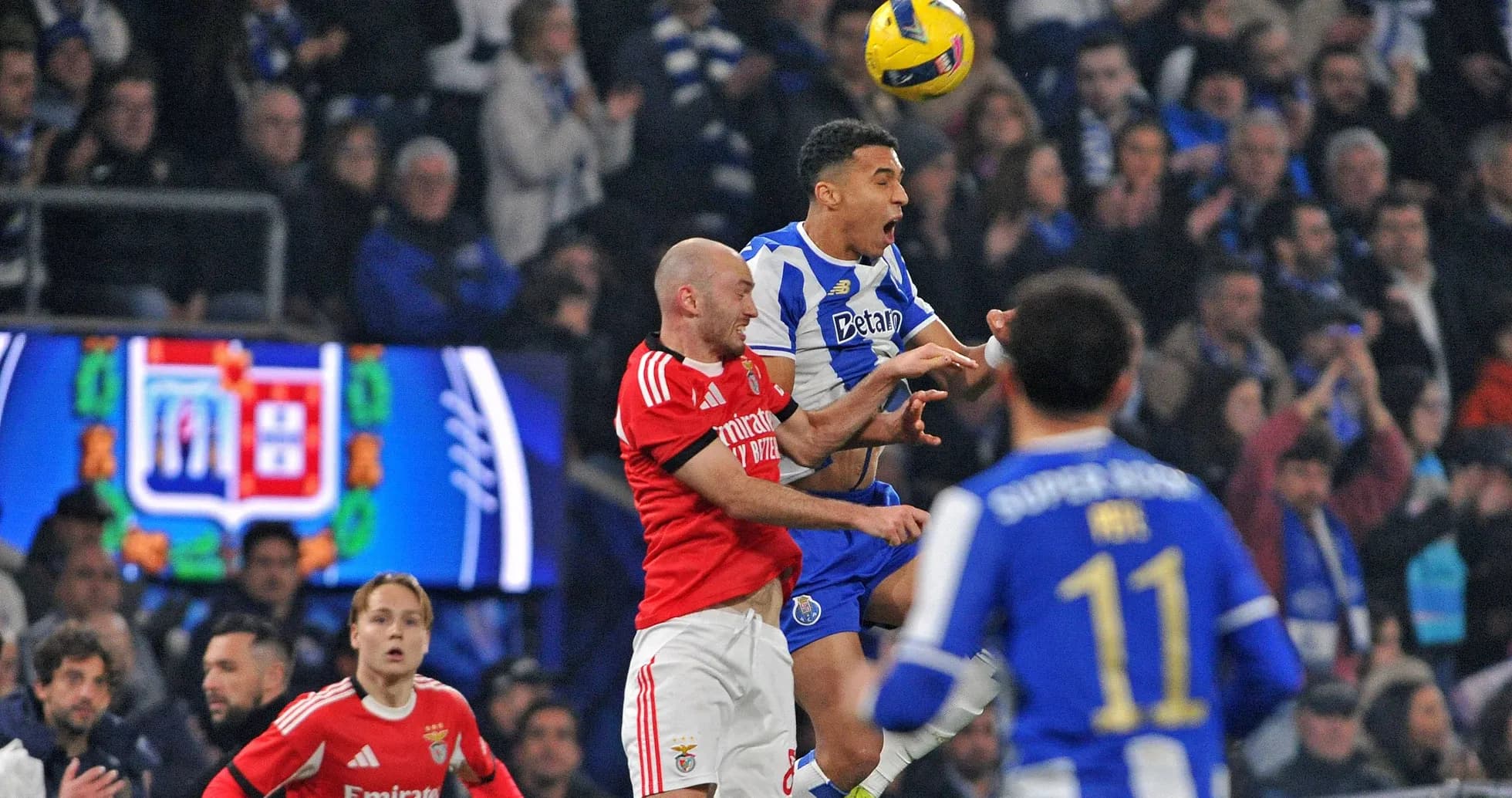Players contesting for the ball during match action Players contesting for the ball during match action