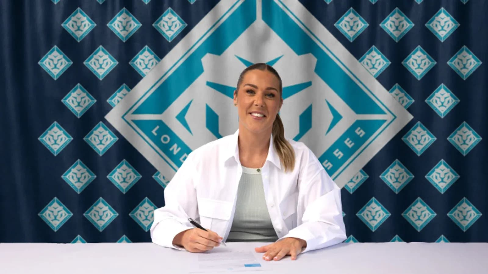 Player signing contract at promotional event Player signing contract at promotional event