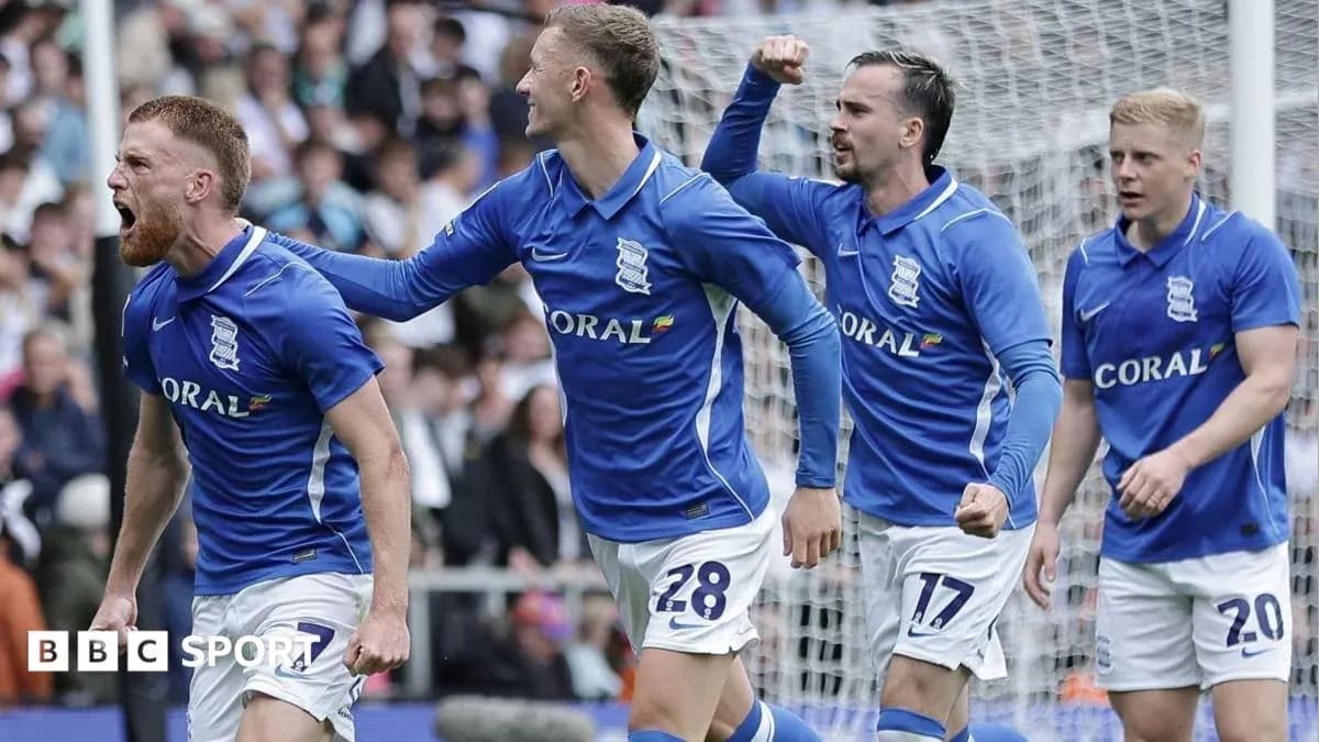 Birmingham City players celebrating a goal on field Birmingham City players celebrating a goal on field