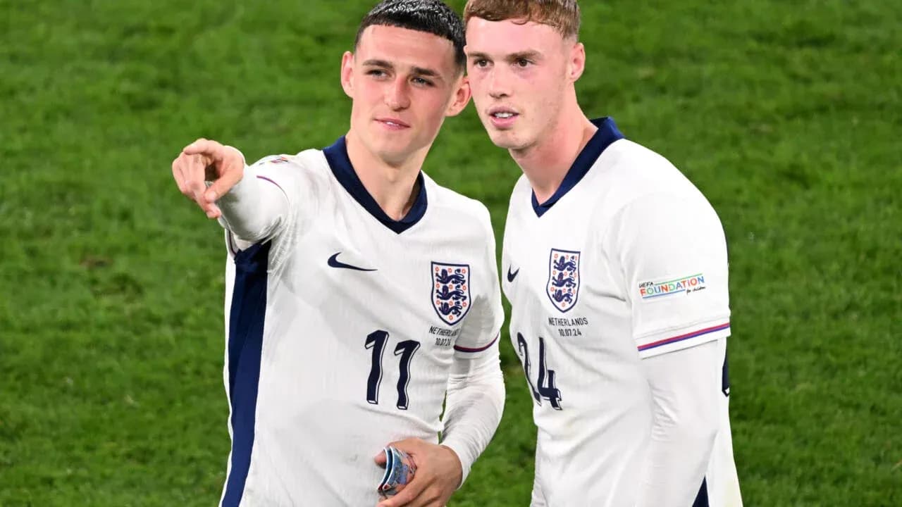 Two England players discussing on the pitch Two England players discussing on the pitch
