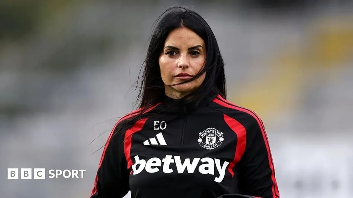 Female coach in Manchester United training gear Female coach in Manchester United training gear