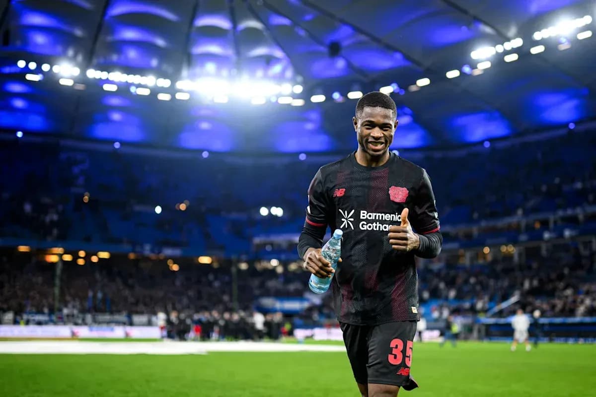 Player celebrating with water bottle on the pitch Player celebrating with water bottle on the pitch