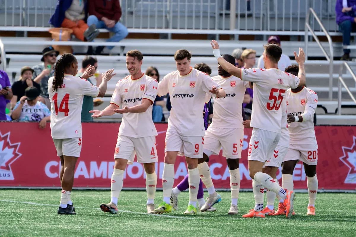 Cavalry FC players celebrating a goal Cavalry FC players celebrating a goal
