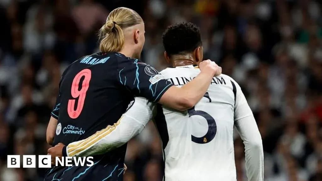 Two players embracing during a football match Two players embracing during a football match