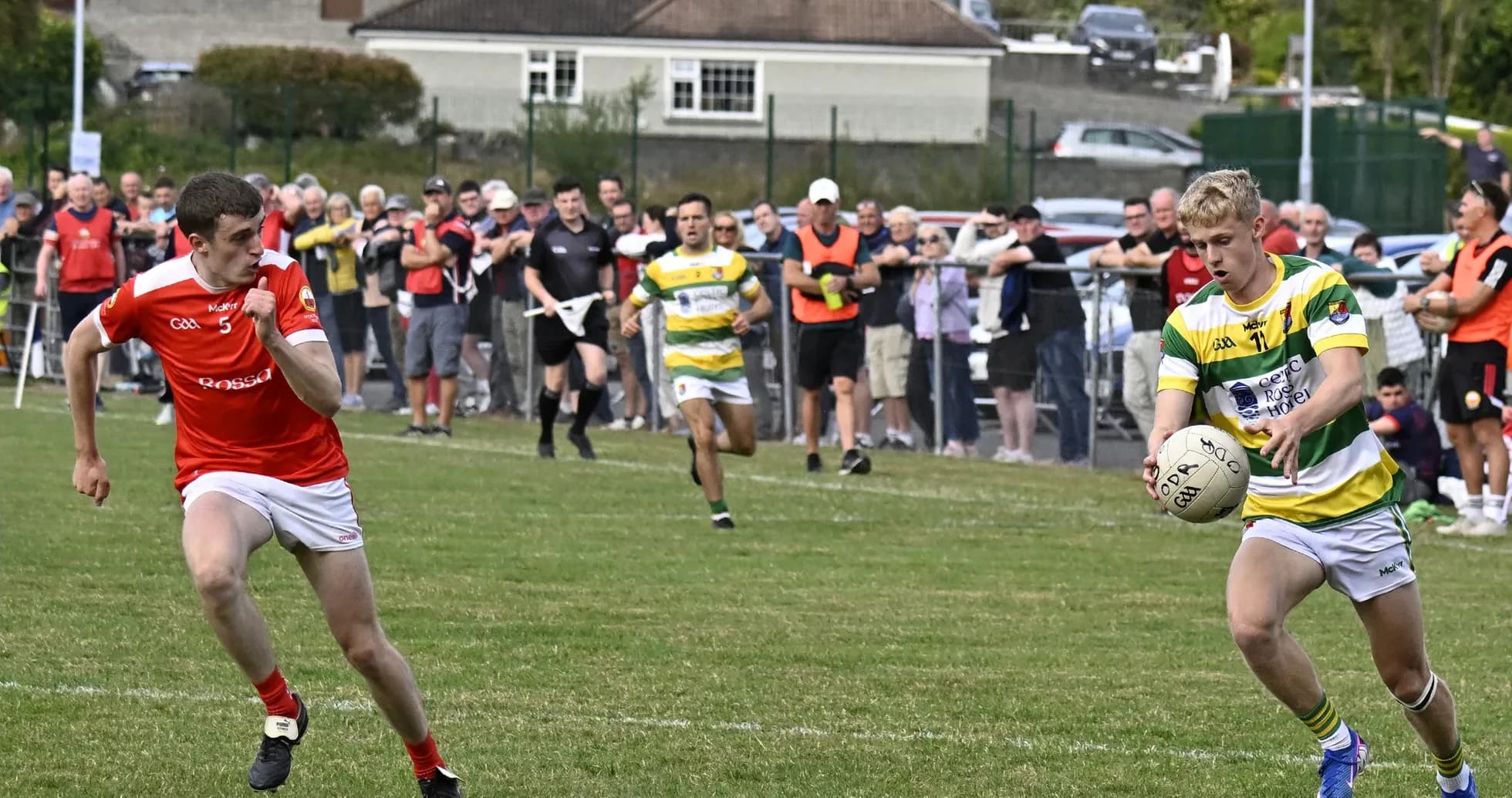 Two players competing for the ball in match Two players competing for the ball in match