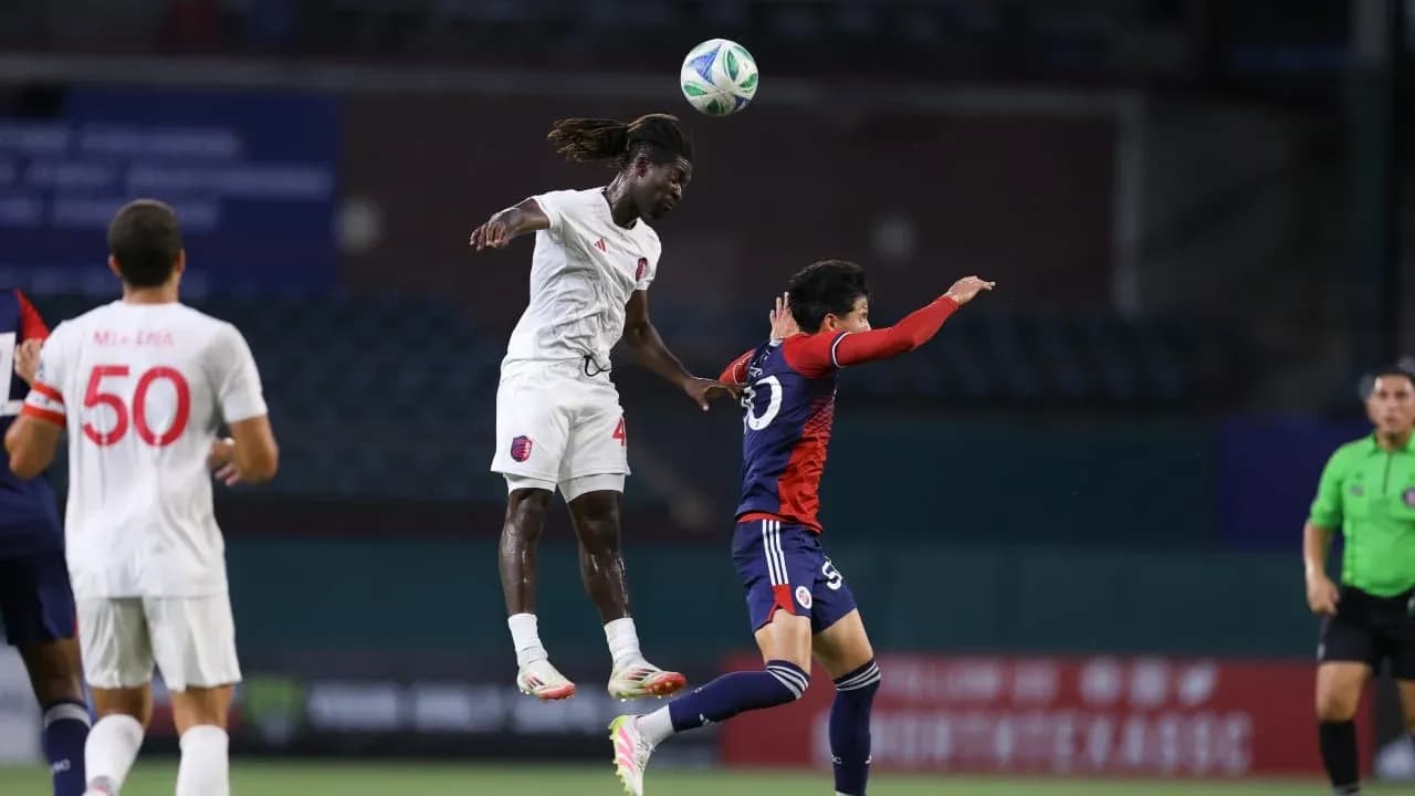Player jumping to head the ball during match Player jumping to head the ball during match