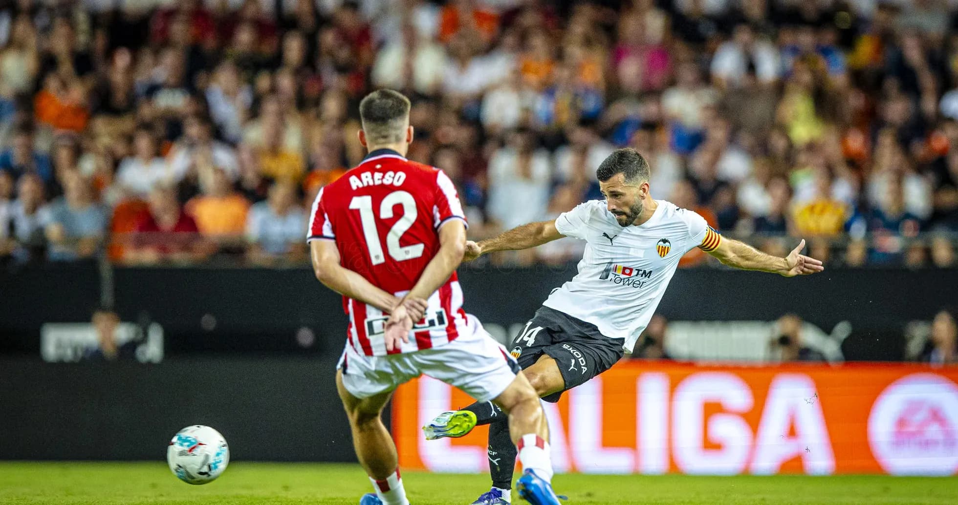 Valencia player shooting during La Liga match Valencia player shooting during La Liga match