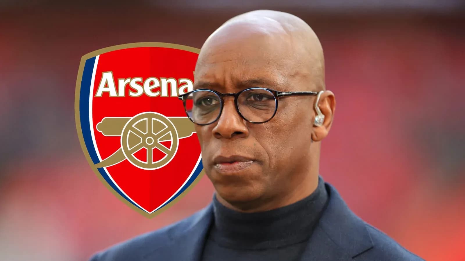 Person in front of Arsenal logo during event Person in front of Arsenal logo during event
