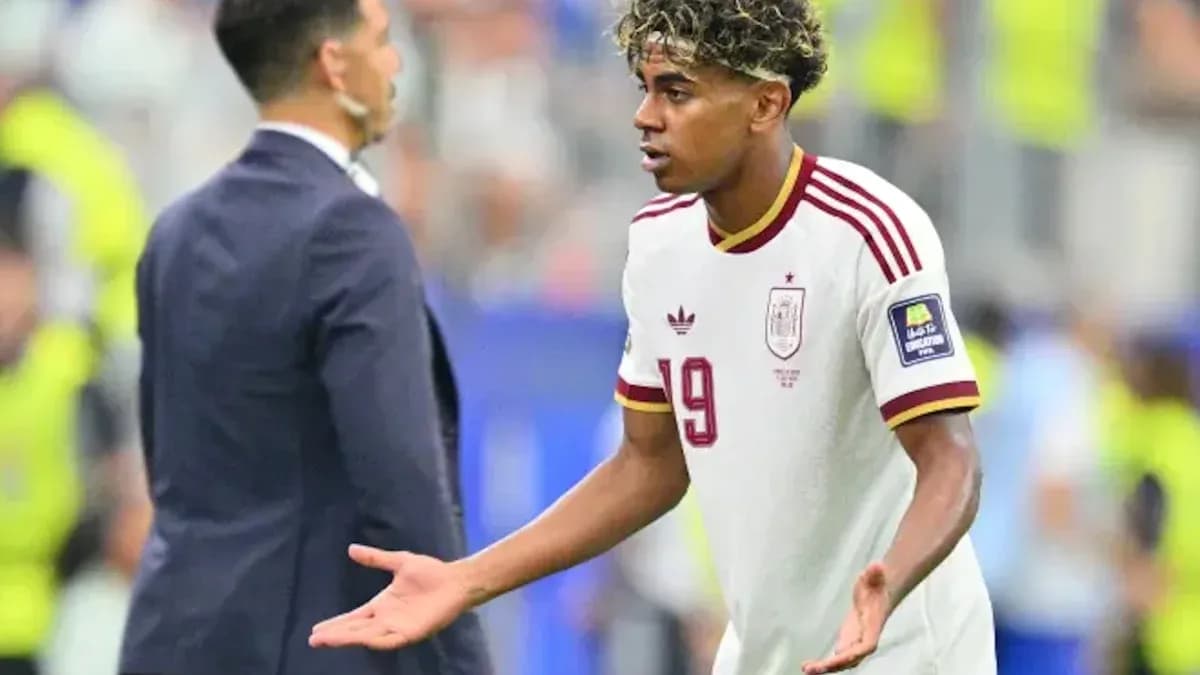 Player gesturing while speaking to coach during match Player gesturing while speaking to coach during match
