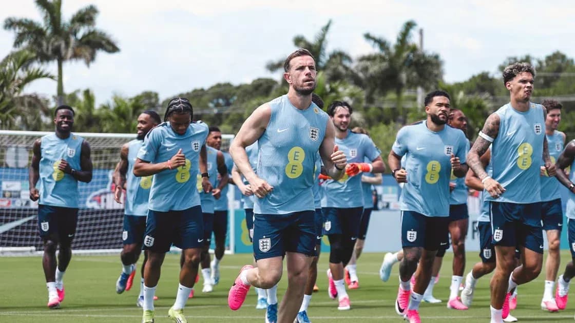 England team jogging during training session on pitch England team jogging during training session on pitch