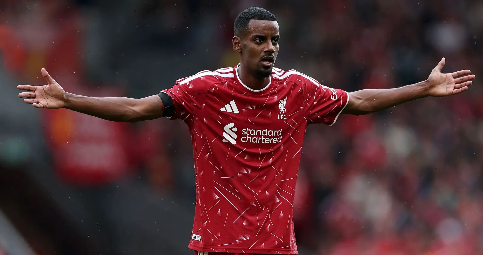 Player gesturing during match in Liverpool jersey Player gesturing during match in Liverpool jersey