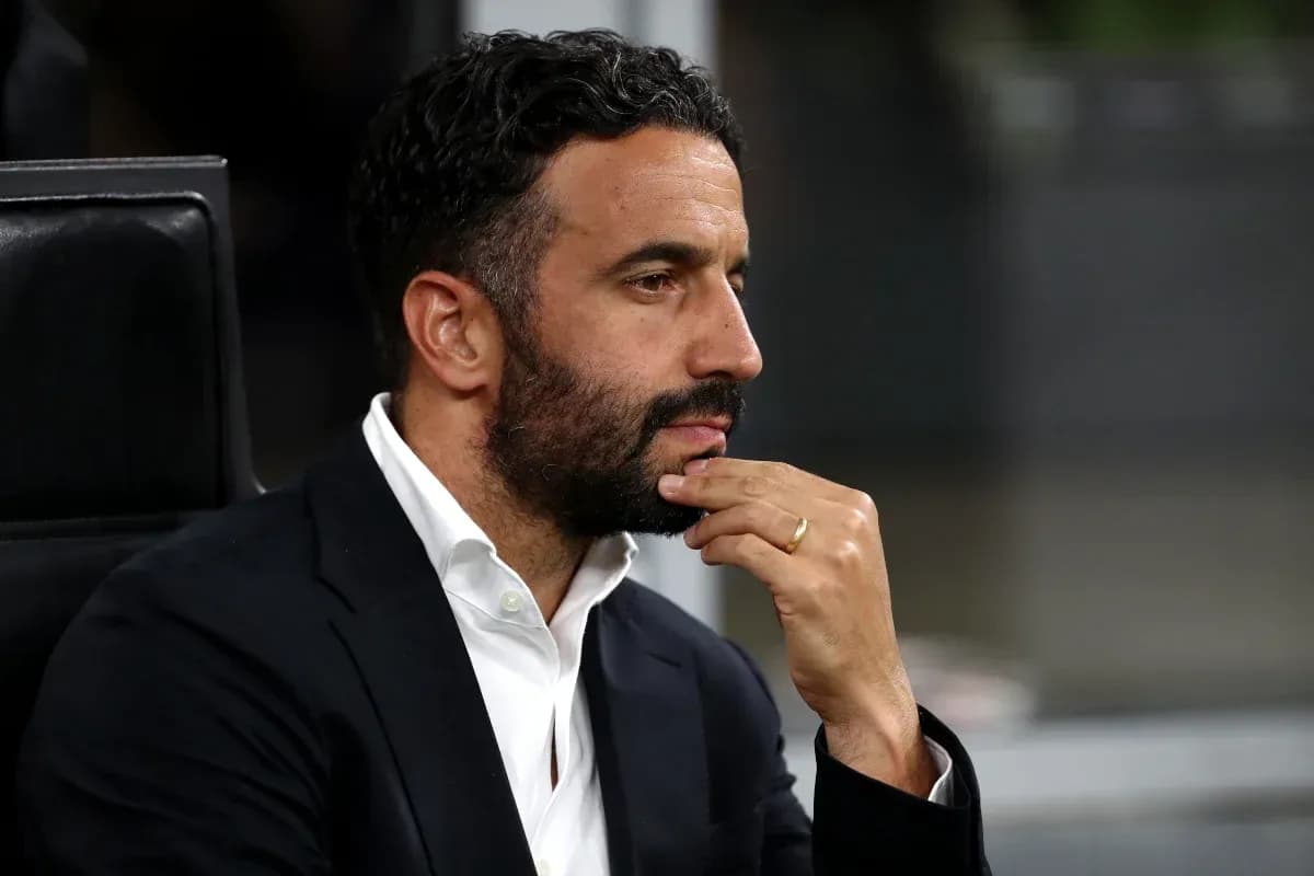 Man in suit contemplating during a match Man in suit contemplating during a match