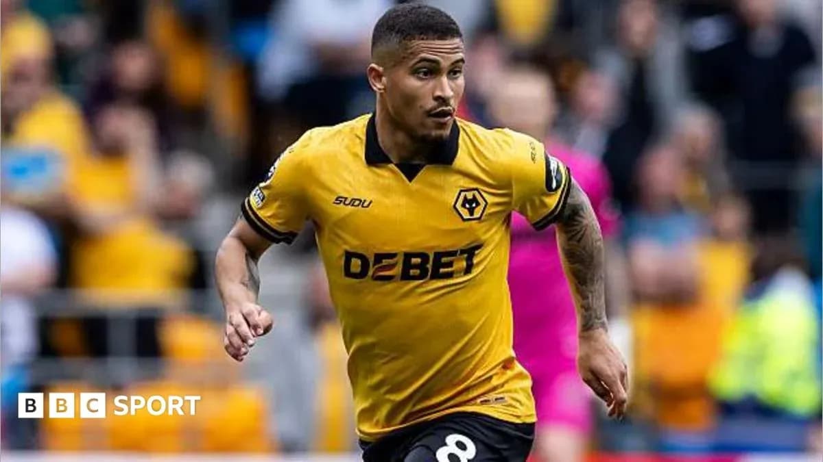 Wolverhampton Wanderers player running on the pitch Wolverhampton Wanderers player running on the pitch