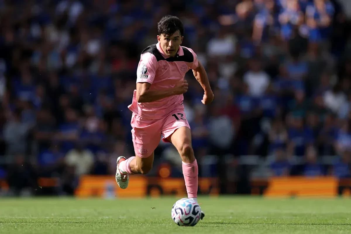 Player in pink kit sprinting with soccer ball Player in pink kit sprinting with soccer ball