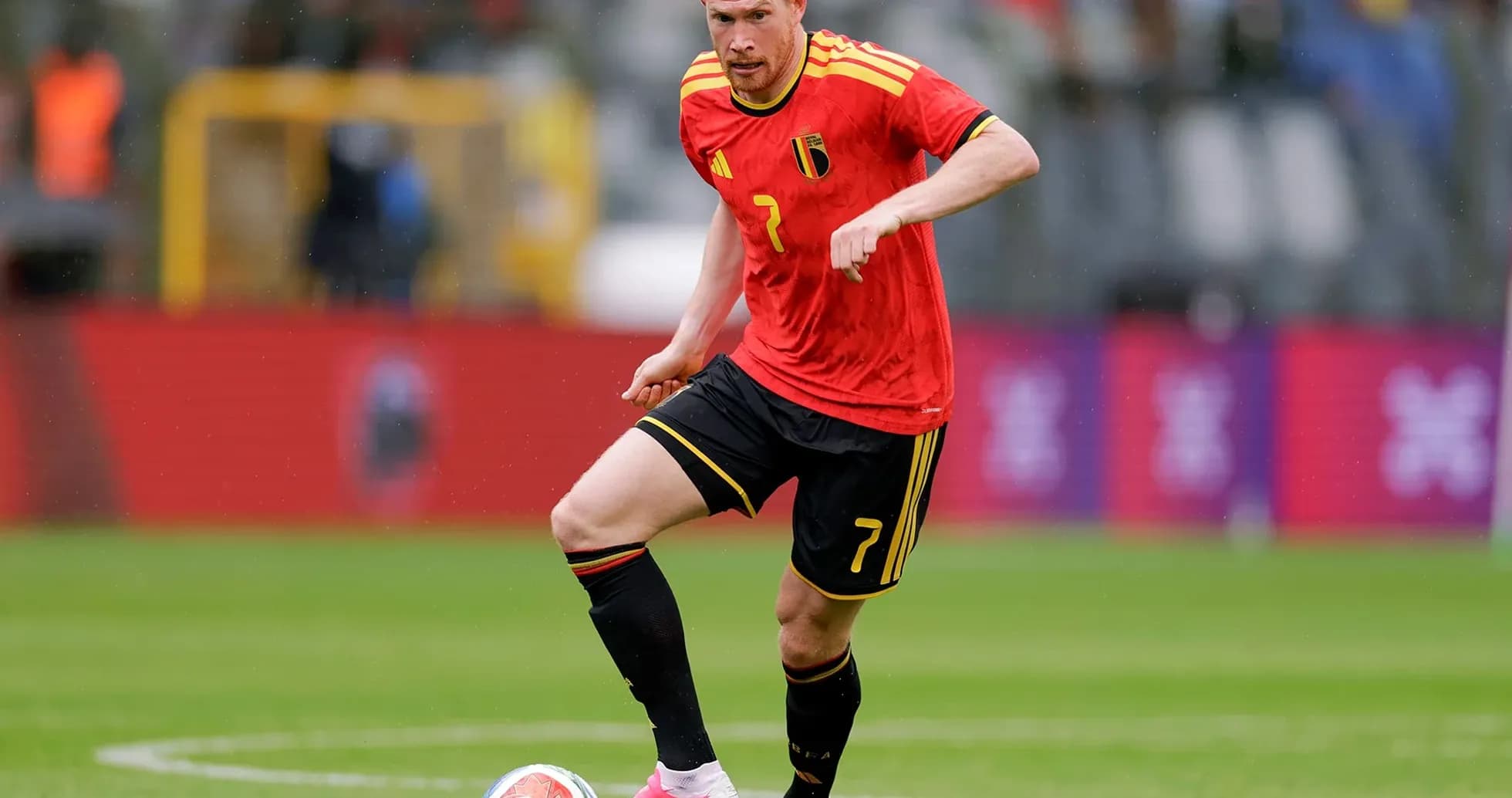 Belgium player dribbling ball on field Belgium player dribbling ball on field