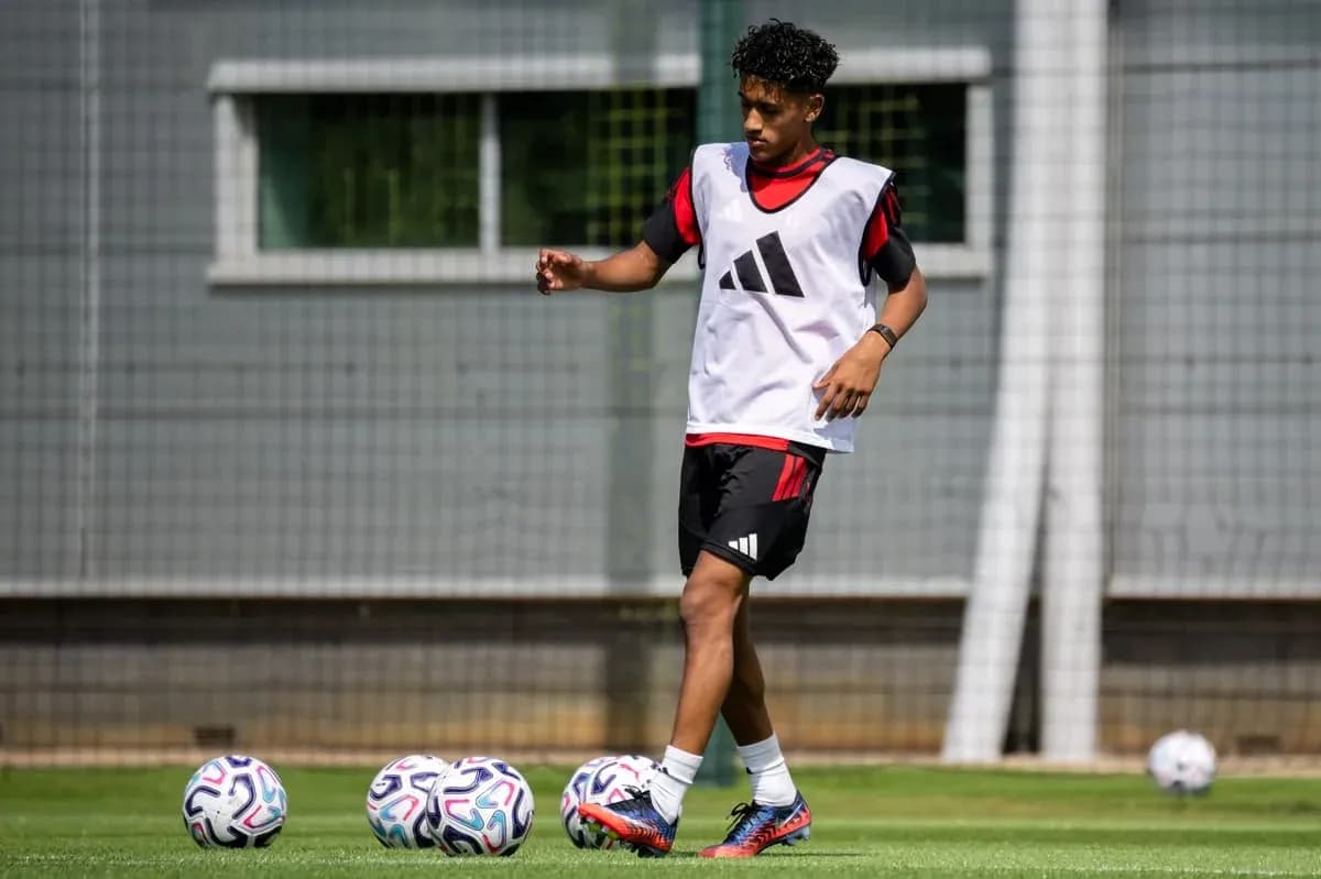 Player training with soccer balls on field Player training with soccer balls on field