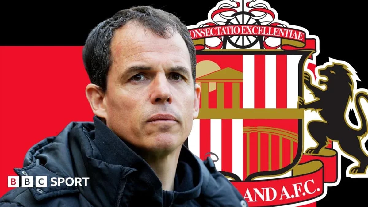 Manager in front of Sunderland AFC logo background Manager in front of Sunderland AFC logo background