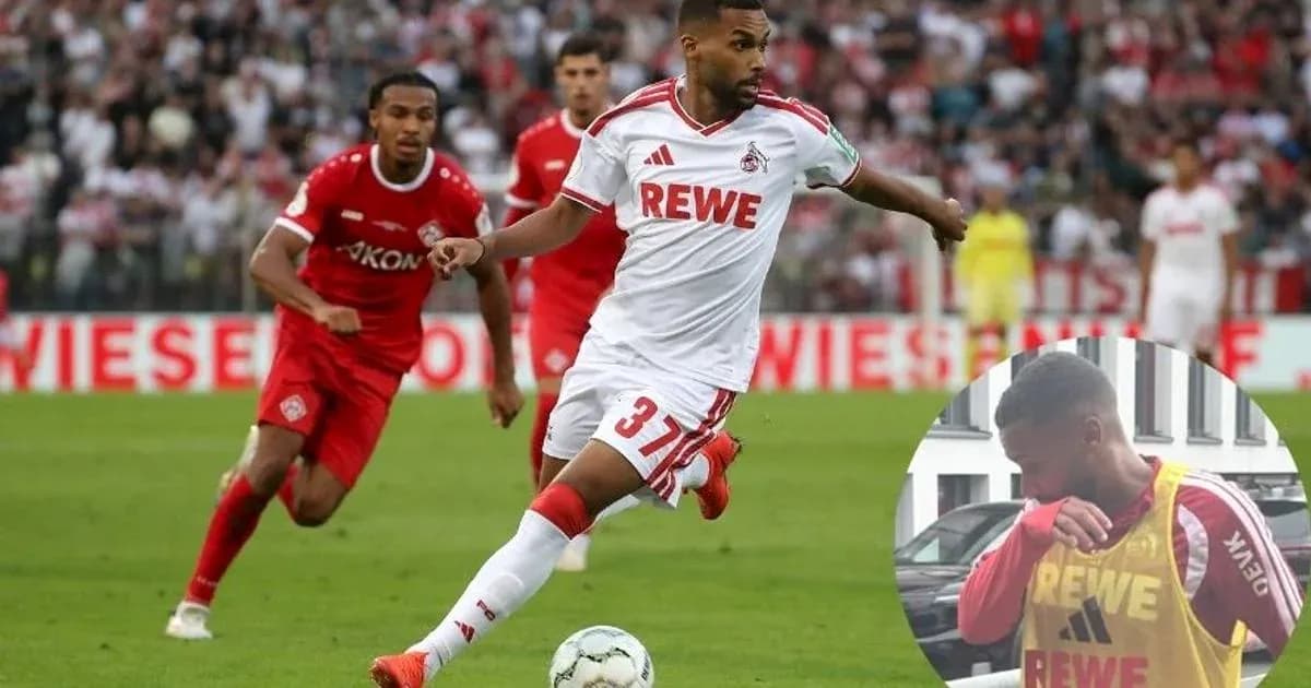 Player in white jersey dribbling during football match Player in white jersey dribbling during football match
