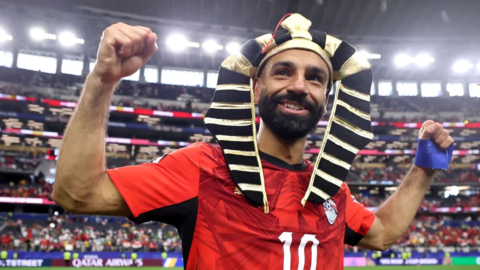 Player celebrating in a Pharaoh headdress after match Player celebrating in a Pharaoh headdress after match