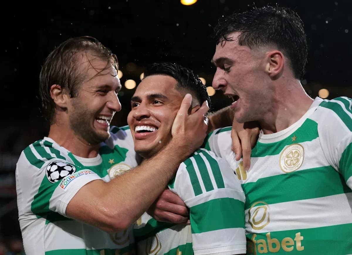 Celtic players celebrating a goal together Celtic players celebrating a goal together