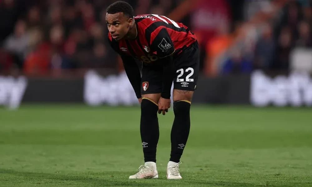 Bournemouth player bending forward on the pitch Bournemouth player bending forward on the pitch