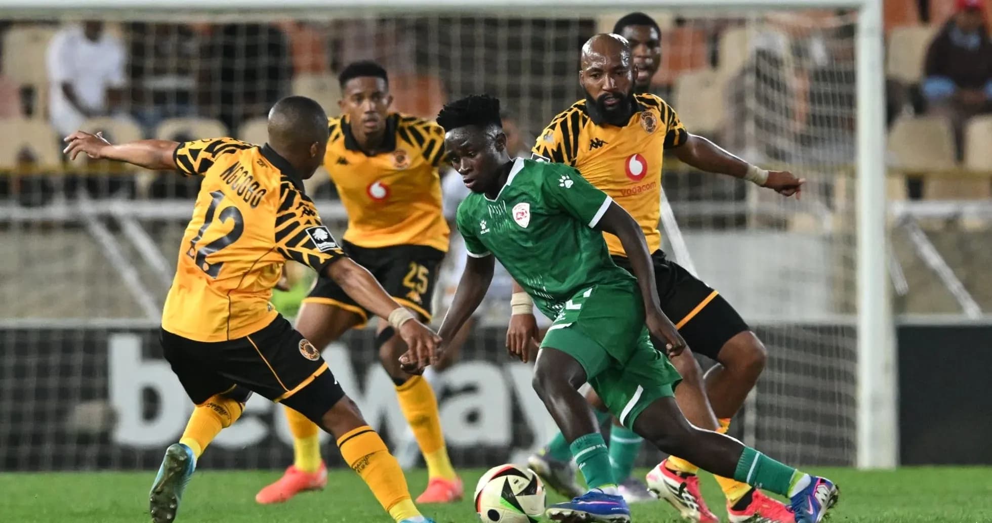Players contesting for the ball during a match Players contesting for the ball during a match