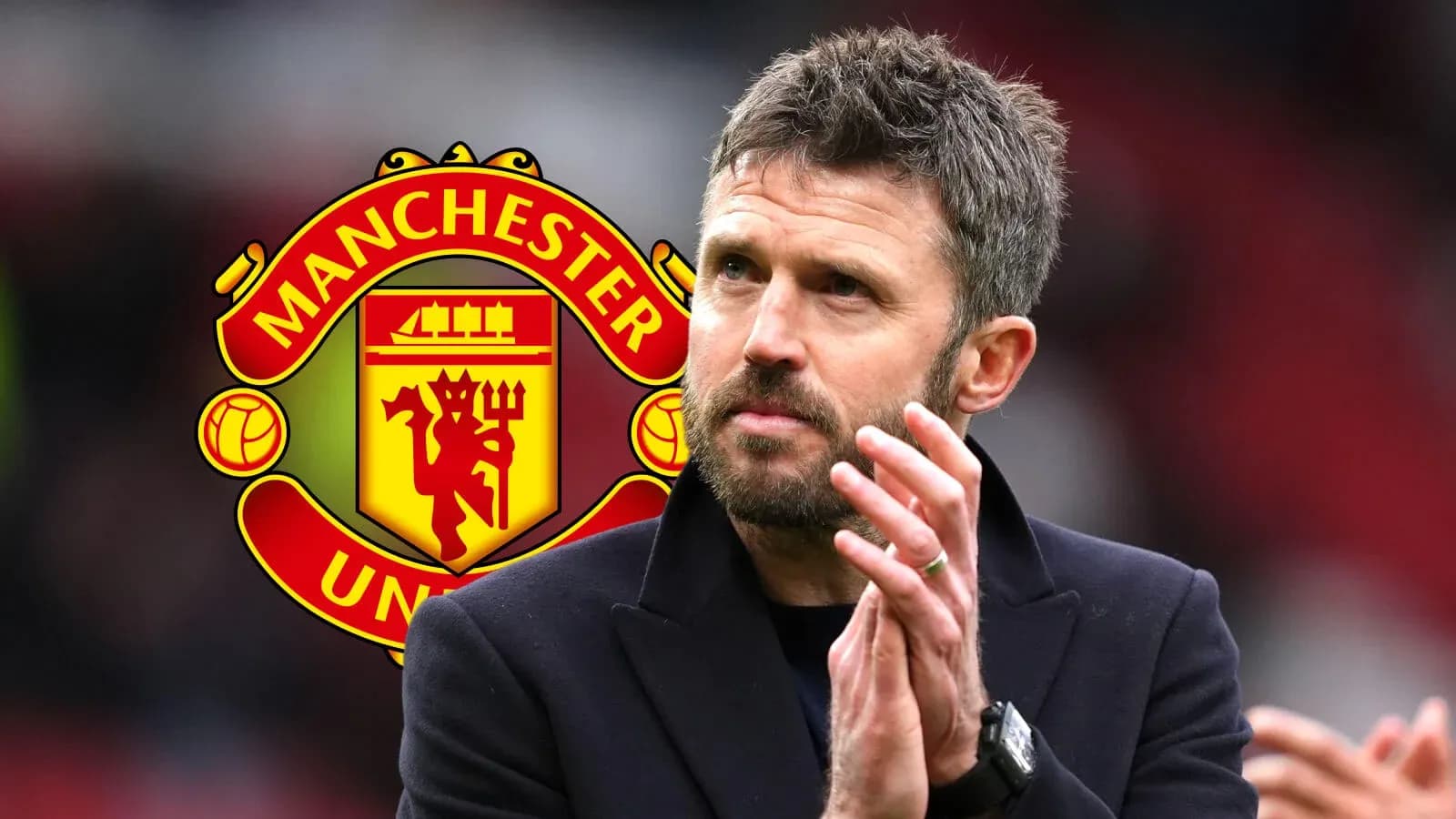 Coach applauding with Manchester United logo in background Coach applauding with Manchester United logo in background