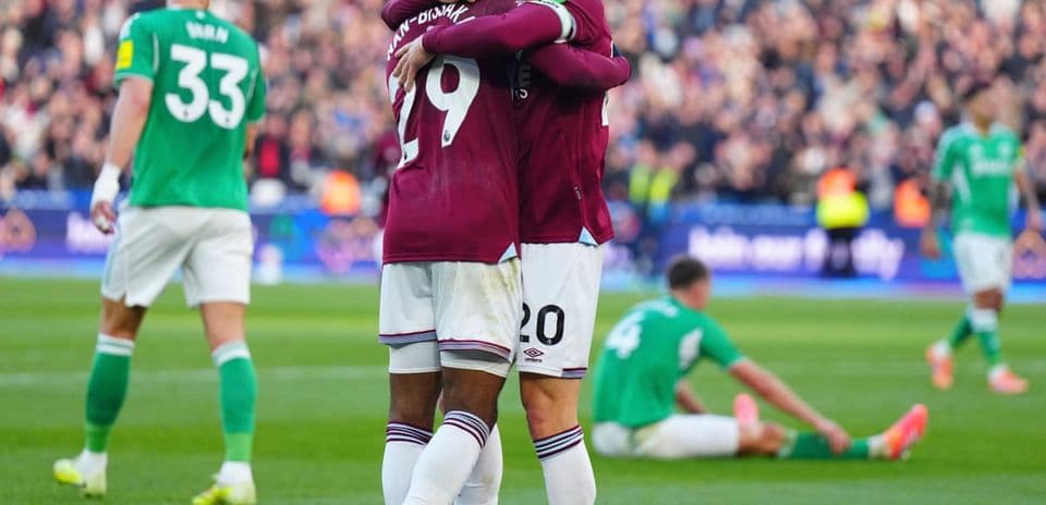 West Ham players celebrating a goal during match West Ham players celebrating a goal during match