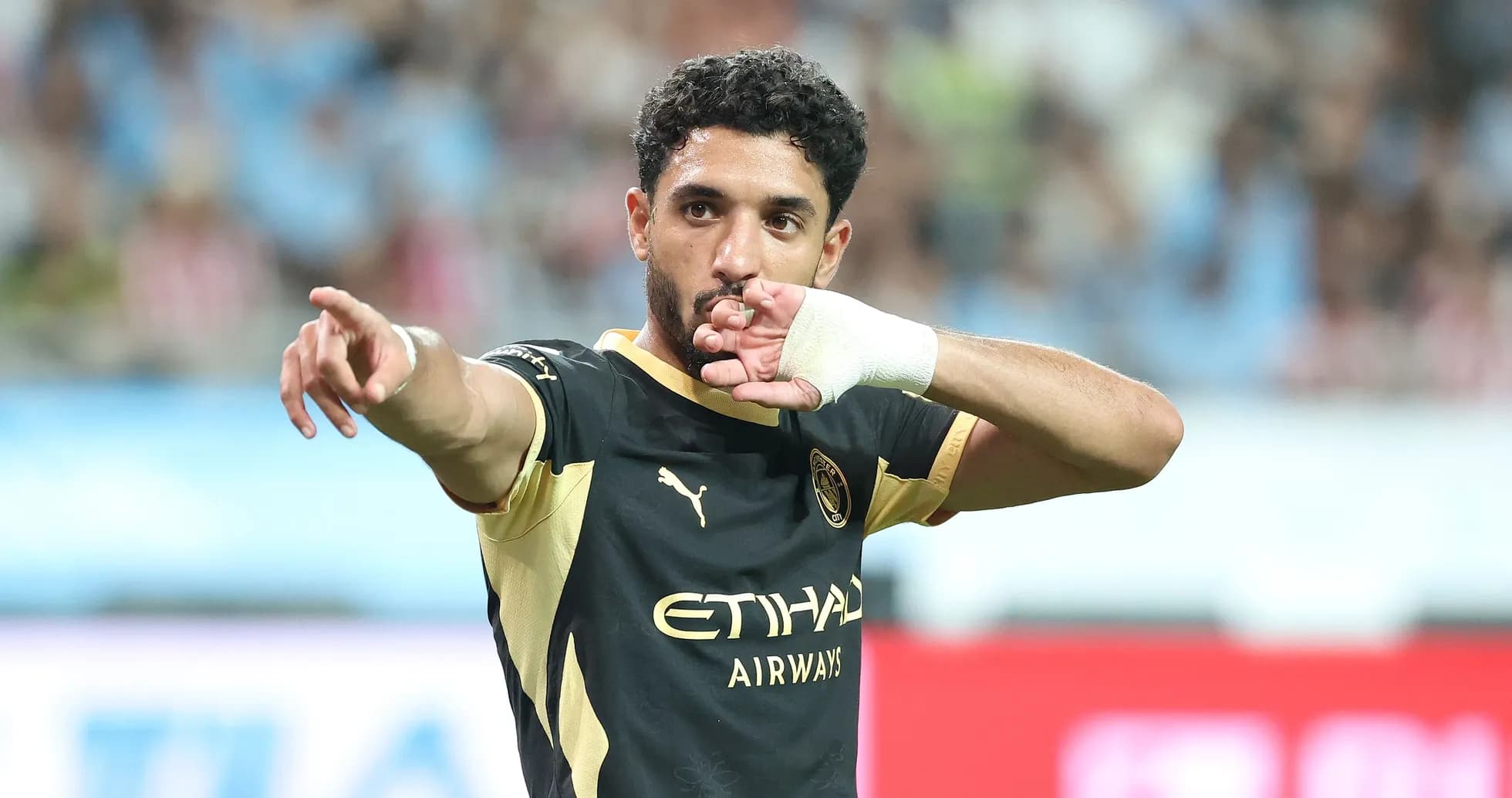 Player celebrating and pointing during match Player celebrating and pointing during match