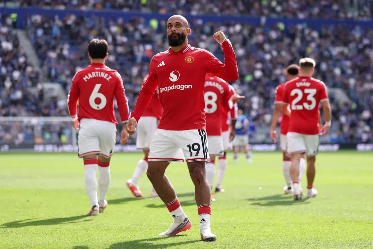Manchester United player celebrating on the pitch Manchester United player celebrating on the pitch