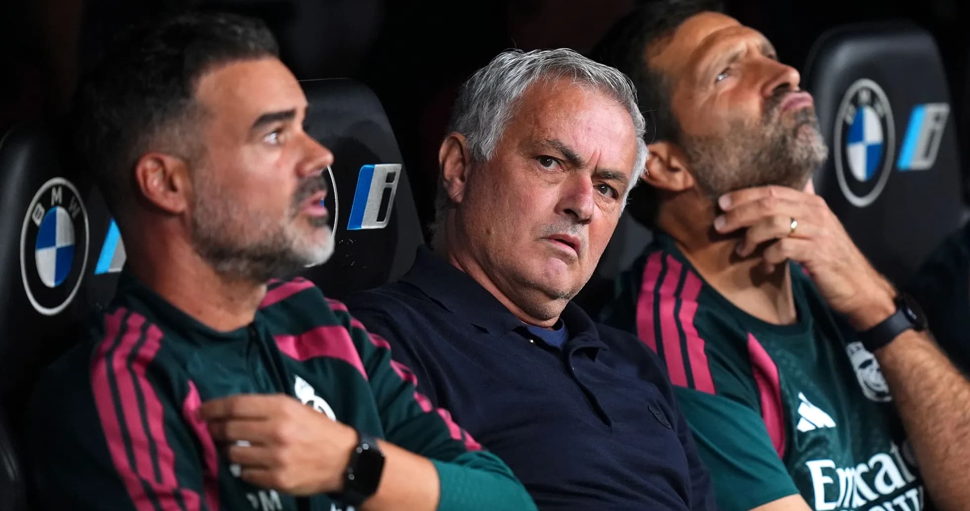 Coaching staff seated on bench during match Coaching staff seated on bench during match