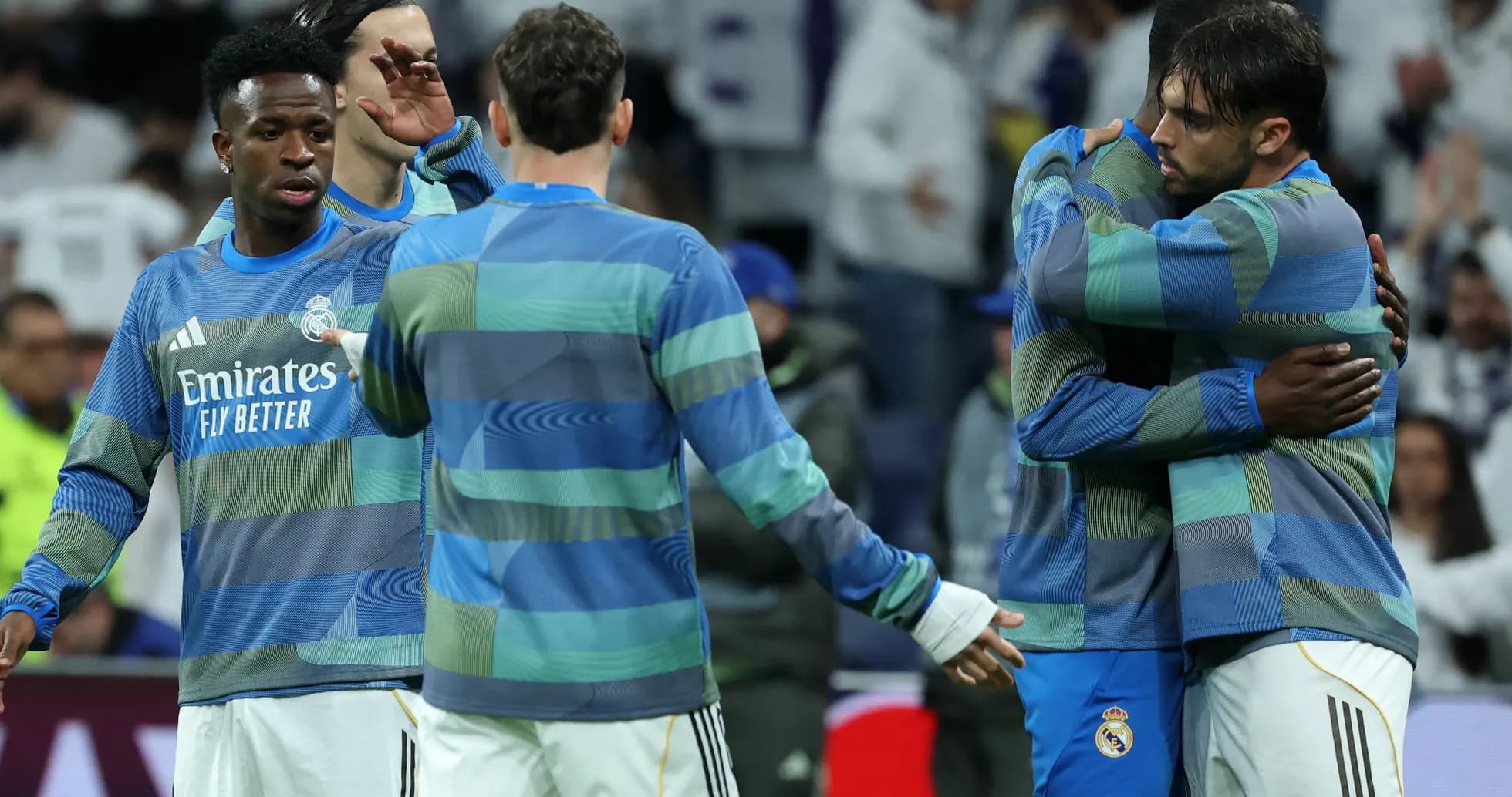Real Madrid players embracing during warm-up session Real Madrid players embracing during warm-up session