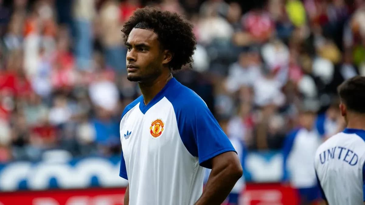 Player in Manchester United training kit on pitch Player in Manchester United training kit on pitch