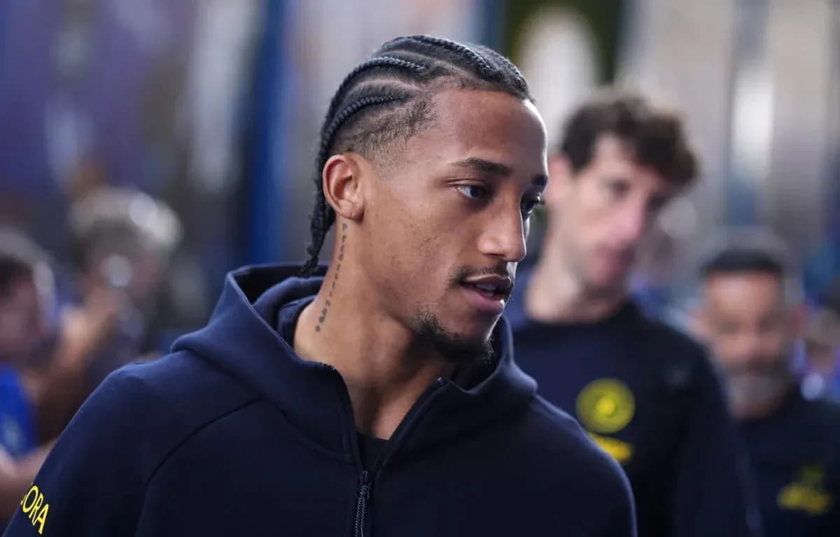 Player with braided hair walking in team hoodie Player with braided hair walking in team hoodie