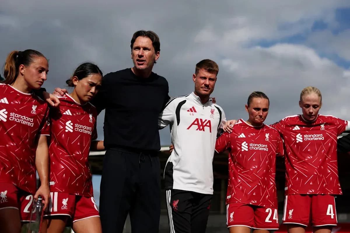 Liverpool women's team huddled together with coaches Liverpool women's team huddled together with coaches