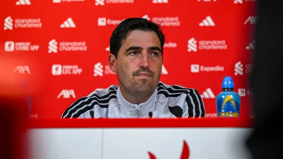 Manager at press conference with red backdrop Manager at press conference with red backdrop